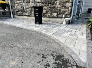 curved-paver-walkway-along-stone-foundation